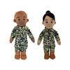 Two dolls in camouflage outfits on a white background