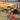 Children hugging their soldier mommy in front of military vehicles, cover of "My Mommy, My Soldier" children's book.
