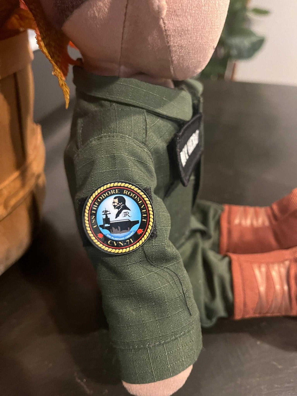 USS Theodore Roosevelt CVN-71 flight suit patch on MY HERO Sailor doll, featuring a high-quality vinyl sticker and Velcro backing.